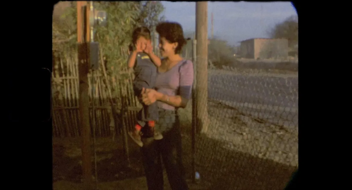 A young Jasmin Mara López held by her mother, Sandra, in the yard of their home in Baja California, Mexico.