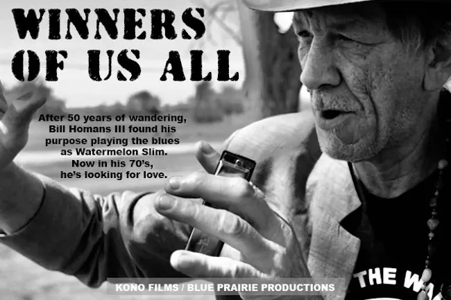 Watermelon slim holds a harmonica and speaks into distance in a black and white photo.