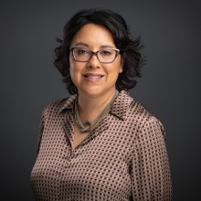 Photograph of Carrie Lozano, a Latinx woman wearing glasses and a patterned shirt. Courtesy of ITVS