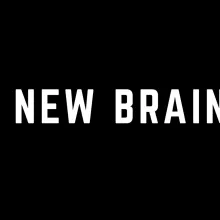 "A NEW BRAIN" in white text in front of a black background