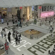 Overhead shot of a shopping center with logos and slogans.