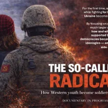 Two figures seen from behind stand side by side, facing St. Basil’s Cathedral in Moscow's Kremlin and a burning battlefield. The image is split between a peaceful cityscape on the left and flames and smoke on the right. 