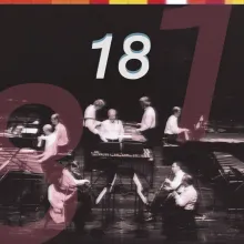 Promotional cover image for the documentary 18, featuring a black-and-white photo of a musical ensemble performing on stage with marimbas, pianos, and woodwinds, overlaid with large translucent red numerals reading "18", the white title "18" centered at the top, and "TOKYO / VERMONT" in the bottom-left corner.