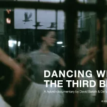 We see ballet dancers through a window dancing. The window also reflects birds in the sky.