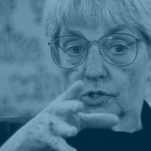 Jana Elliott, a while older lady with glasses, captured while talking. From Bertram Verhaag and Claus Strigel, 'Blue Eyed' profiles the life and work of Jana Elliott, a former teacher who was the subject of the 1960s film 'Eye of the Storm' and who has committed herself to leading a fight against prejudice and racism in society
