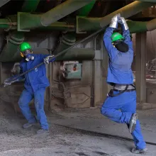Two Guadeloupean factory workers working in their blue uniforms. From Sylvaine Dampierre’s ‘Words of Negroes.’ Courtesy of DOK Leipzig. 