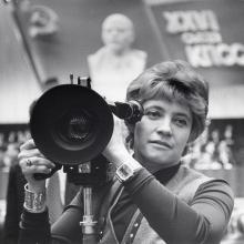 A black-and-white image of filmmaker Marina Goldovskaya filming at a Community Party convention in Russia. Photo courtesy of Esther Shubinski.