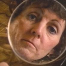 A protagonist looks into a hand-held mirror in Lee Grant's 'What Sex Am I?" Courtesy of Criterion Channel