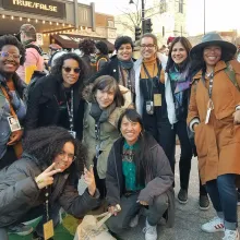 Iyabo Boyd (left), a Black woman with short hair and glasses, is standing with other women of color documentary professionals—all members of Brown Girls Doc Mafia—during True/False fest. Courtesy of Brown Girls Doc Mafia.