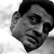 Side angle black and white portrait of filmmaker Satyajit Ray. Courtesy Criterion Channel.