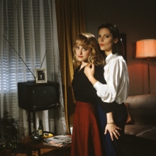 Two lesbians pose in a living room from 'Forbidden Love: The Unashamed Stories of Lesbian Lives.'