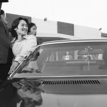  A black-and-white photo shows Chol Soo Lee, an Asian American man, smiling outside of a car after being released from prison, From Julia Ha and Eugene Yi's ‘Free Chol Soo Lee.’ Photo courtesy of Grant Din/ITVS.
