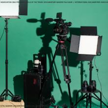 cine cameras and lenses in front of seamless paper background