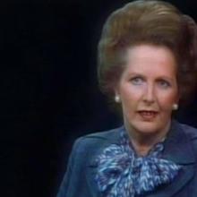 A woman with a fair complexion and blonde hair looks at the camera, from Nick Broomfield's 'Tracking Down Maggie: The Unofficial Biography of Margaret Thatcher.'