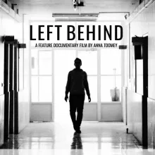 A silhouetted student walks through the hallways of this public high school.