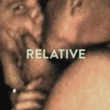 home video screenshot from 1940. Man kissing a woman as she looks into camera.
