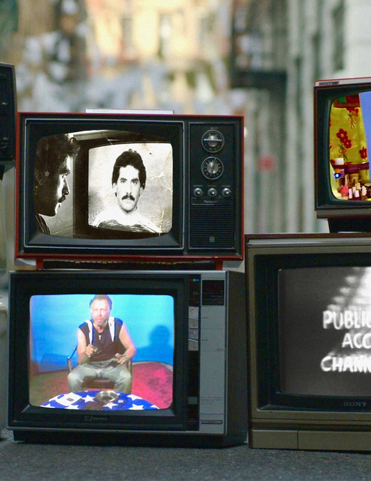 Various vintage television sets made to look like they're laying on the ground on a New York City street show scenes from public access Tv shows