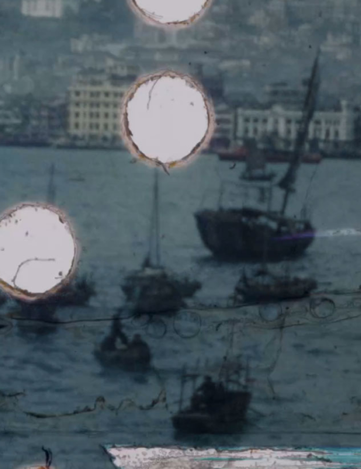 A blue image of ships in a bay is riddled with several small circular holes on the left half of the image, revealing a white background