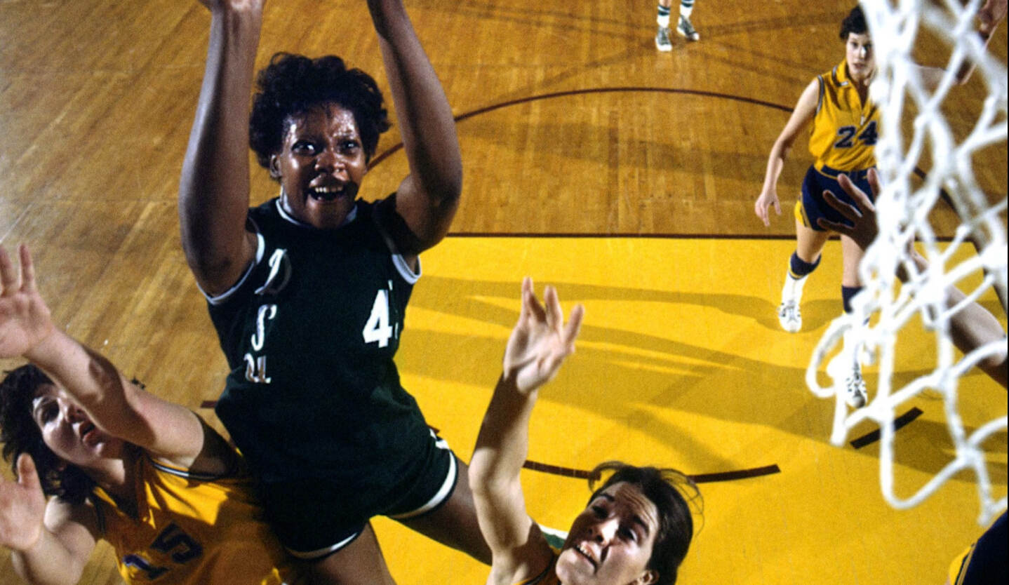  Lusia Harris, a Black basketball player  is in mid-air, basketball in one hand, about to score. From Ben Proudfoot’s Academy Award-winning short ‘The Queen of Basketball.’ Courtesy of Breakwater Studios.
