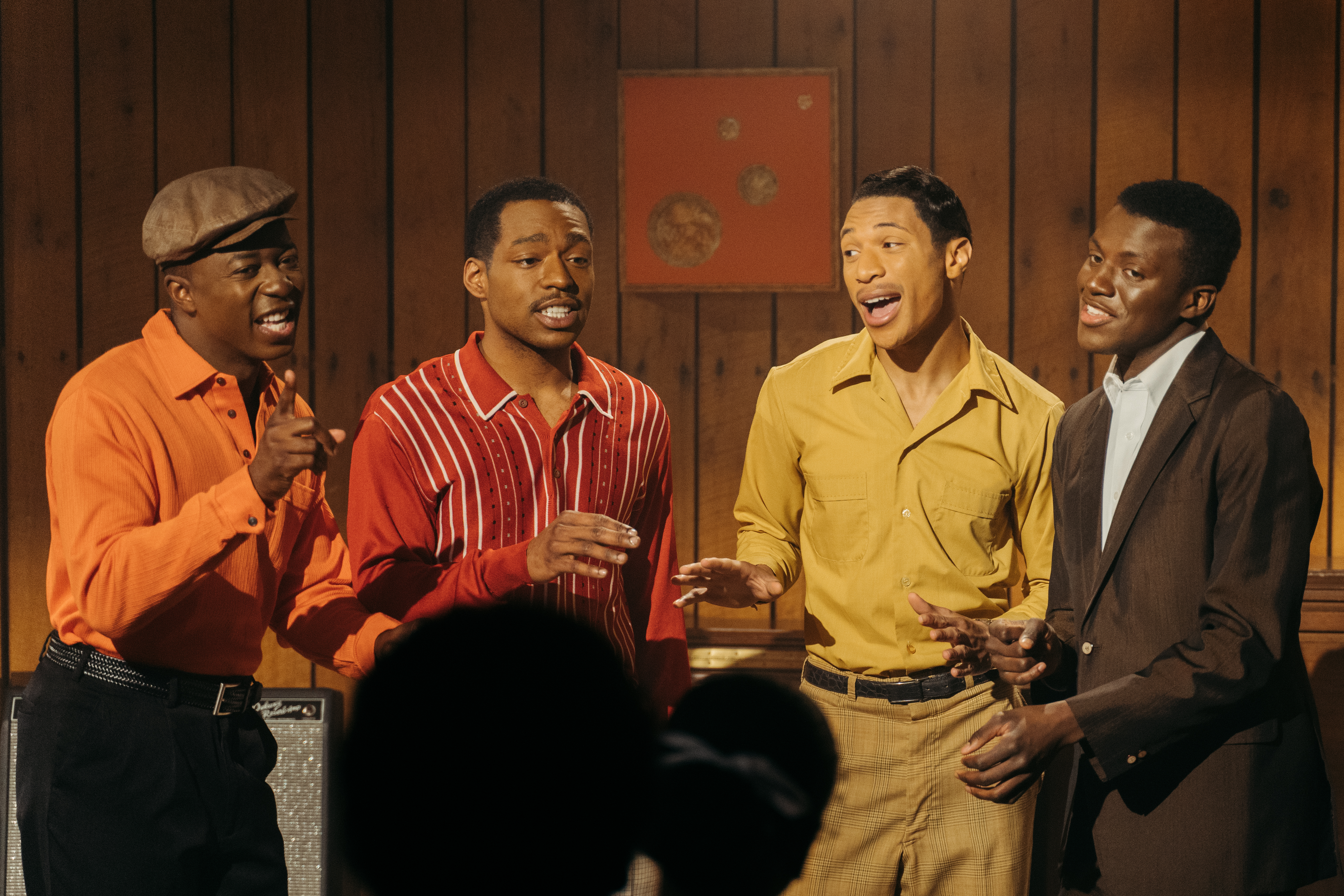 A doo-wop group of four Black men performs in a wood-paneled room. From Julian Turner's 'The Big Three.' Courtesy of BlackStar Film Festival.